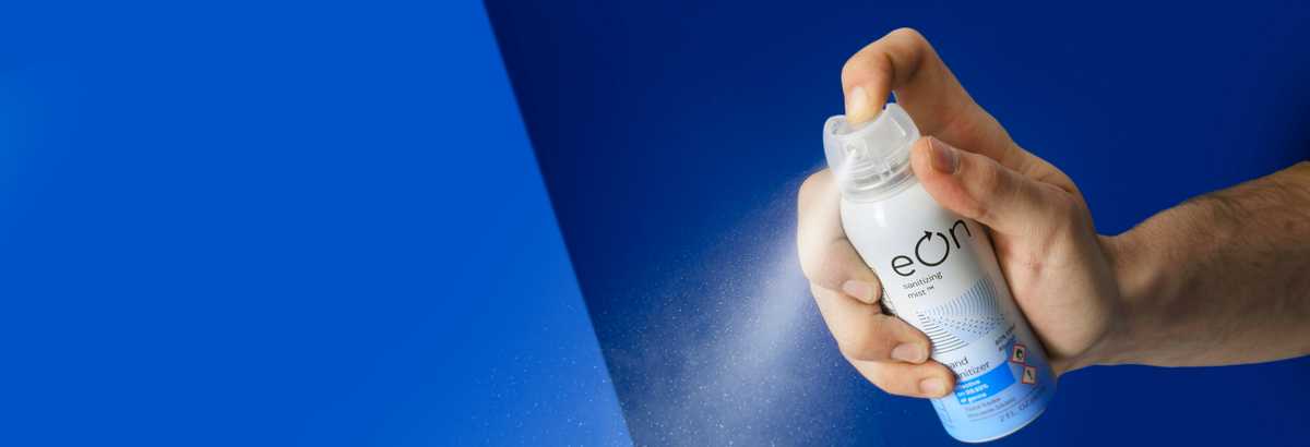 eOn hand holding a can